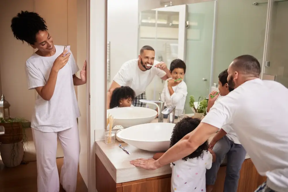 Central Florida plumbing - happy family brushing teeth in bathroom