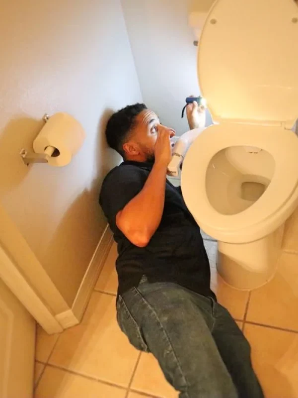 Kenny fixing toilet
